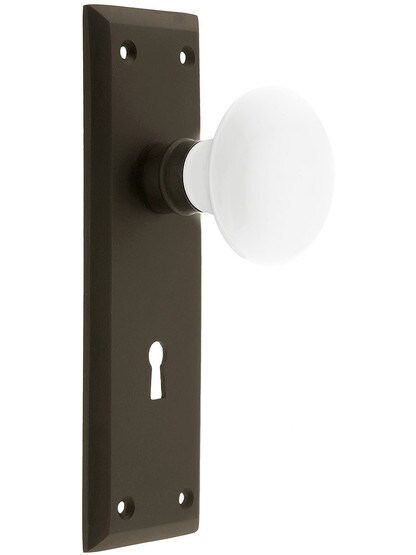 Classic New York Style Mortise Lock Set in Oil-Rubbed Bronze with White Porcelain Door Knobs.